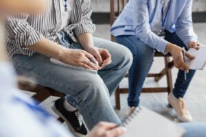 close-up-people-sitting-chairs